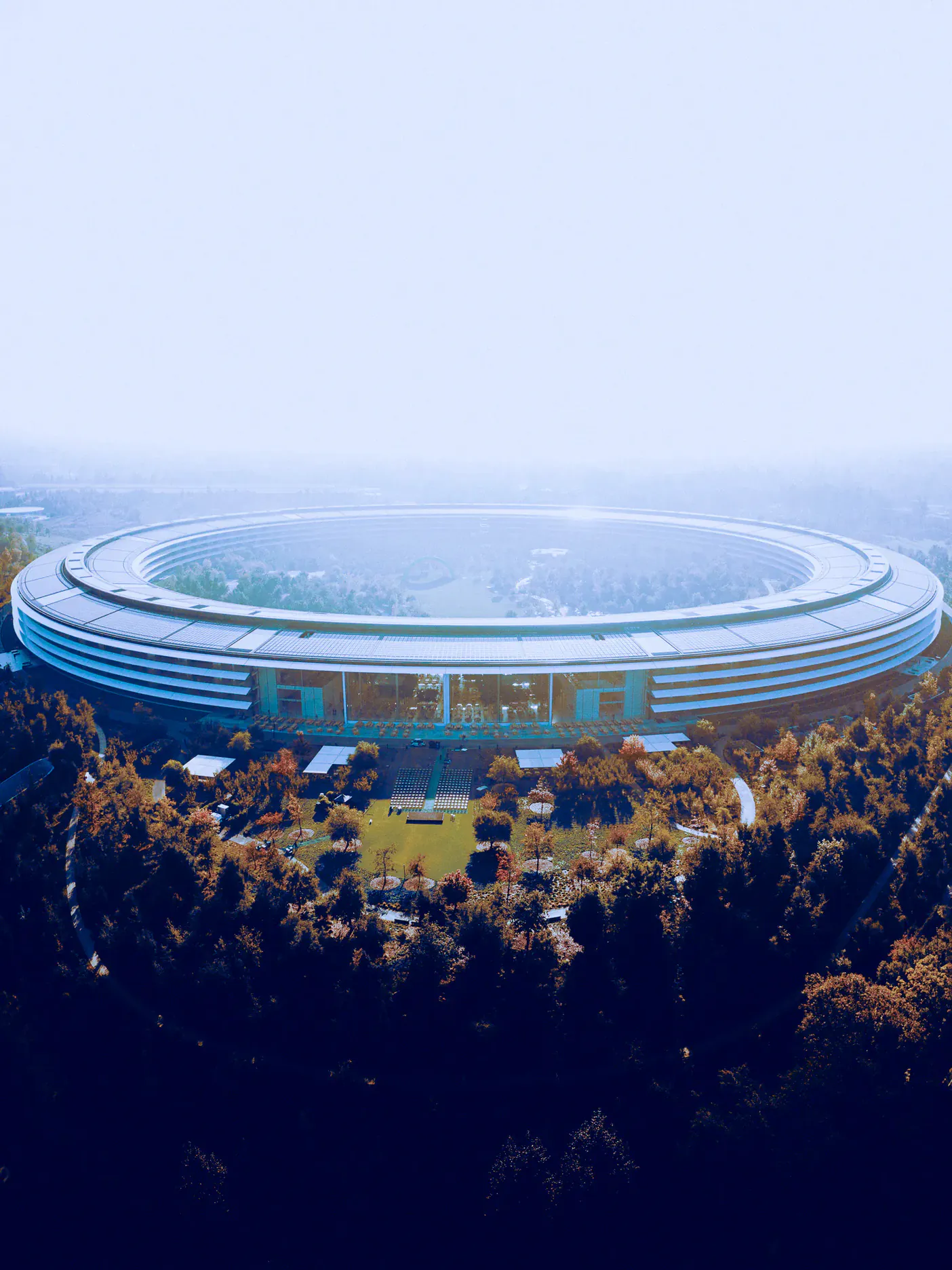 Apple Park in Cupertino, seen from above through morning haze